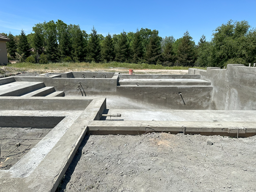 Custom gunite pool and spa with fire pit under construction