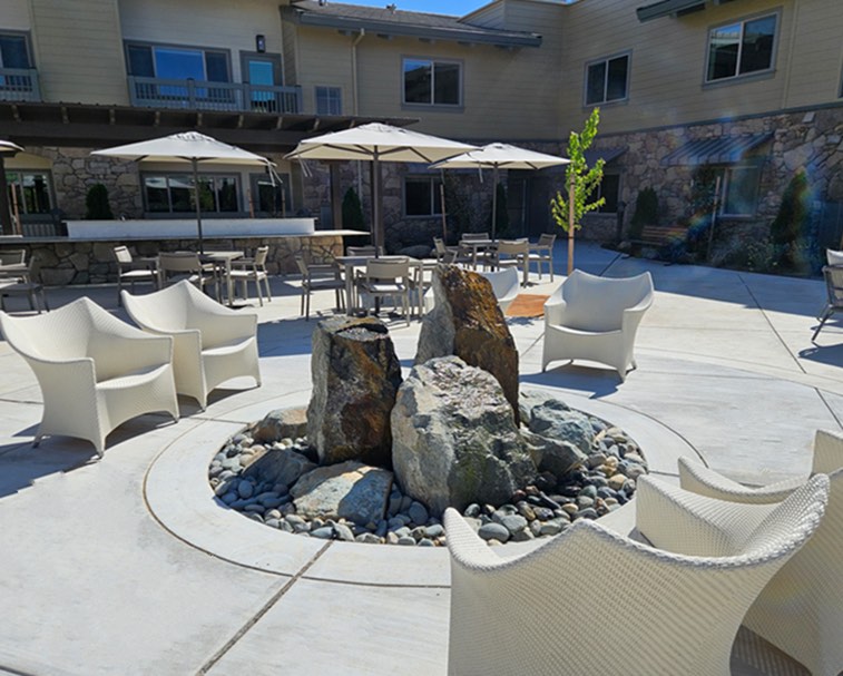 Three boulder rock cluster fountain custom built for senior living apartments in Auburn, California