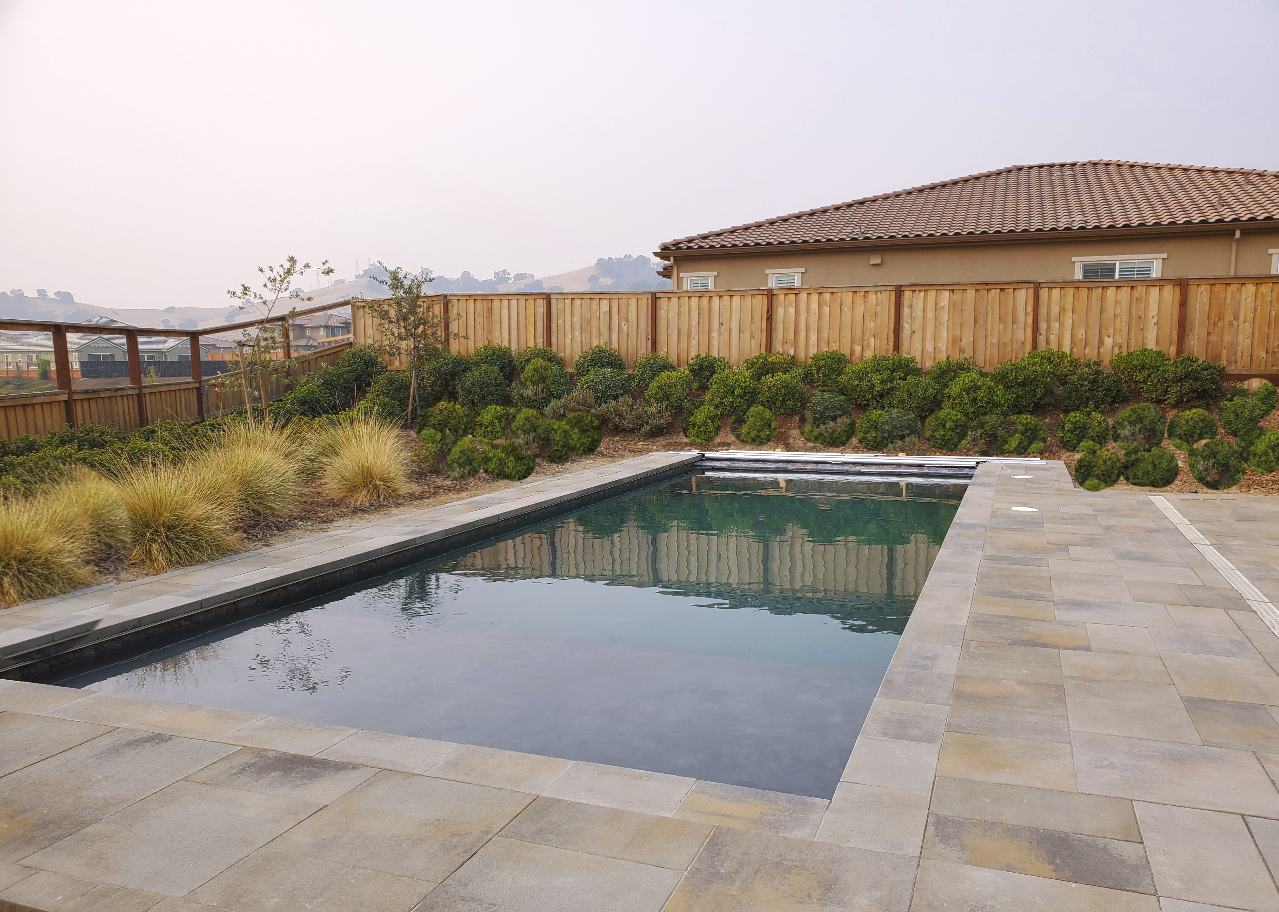 Rectangular shaped pool with automatic pool cover.