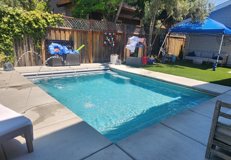 Small Rectangular Pool with Pool Cover and Deck Jets