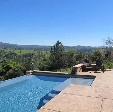 Infinity edge rectangular shaped pool.