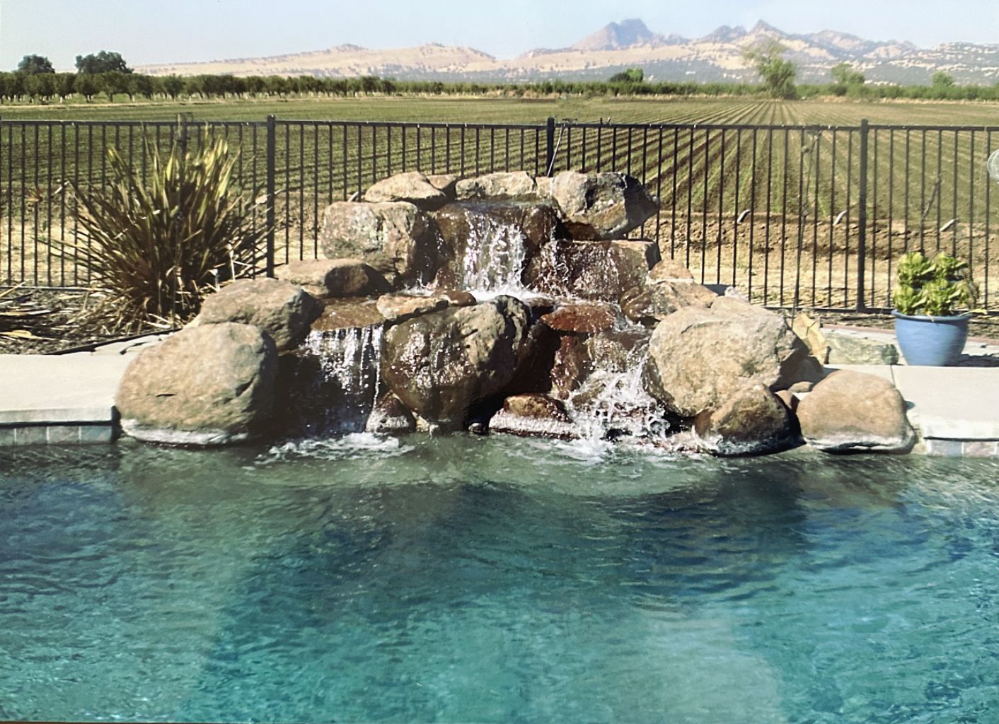 Small rock waterfall for swimming pool.