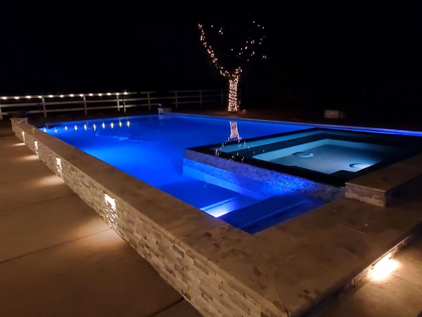 Raised pool with ledgerstone facing and spa.