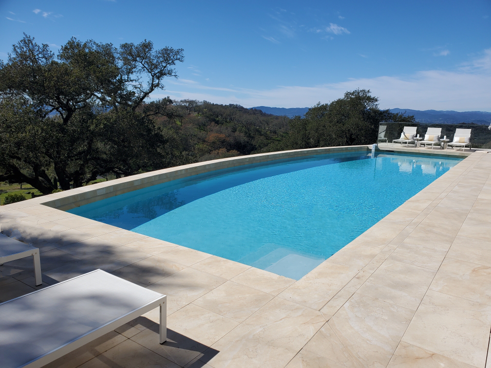 Residential pool on a sloped lot with a view of the hills in Northern California