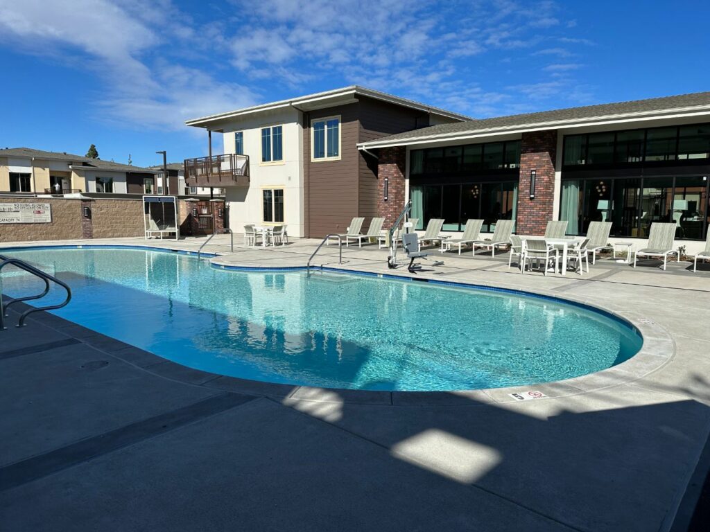 Large oval custom shaped commercial pool approximately 1,600 square feet for apartment complex in Rocklin, California