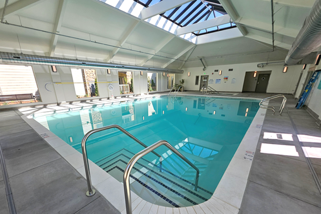 Large indoor 1,200 square foot pool plus spa for senior living apartments in Auburn, California