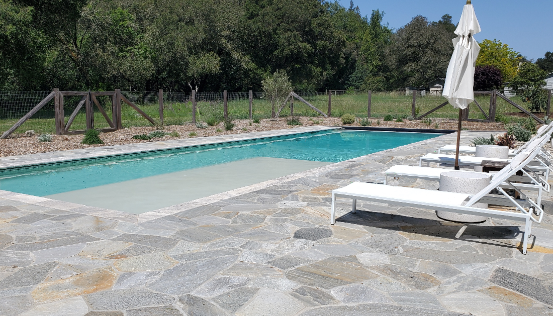Rectangular pool with automatic pool cover in wine country