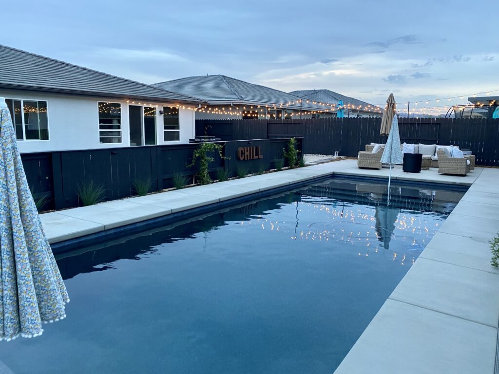 Rectangular pool with Cabo shelf in Vacaville backyard